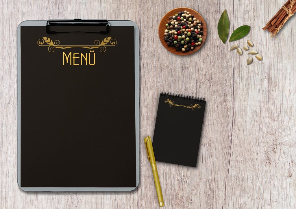 menu, writing pad, table